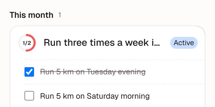 Goal card "Run three times a week in October", progress 1/2, expanded to show its tasks